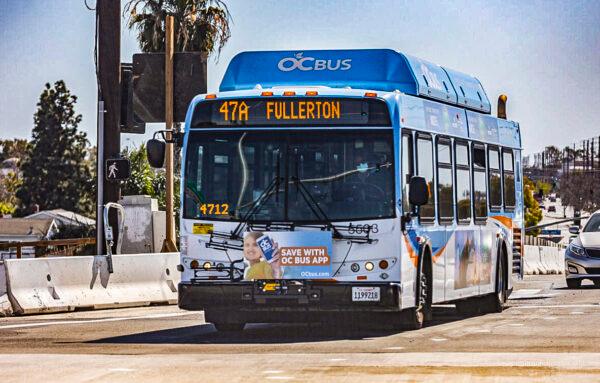 An Orange County Transportation Authority bus transports passengers to Fullerton, Calif., on March 1, 2021. (John Fredricks/The Epoch Times)