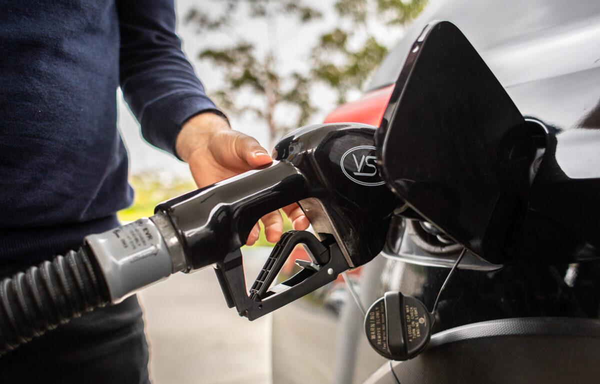 A man pumps gas in Irvine, Calif., on April 1, 2022. (John Fredricks/The Epoch Times)