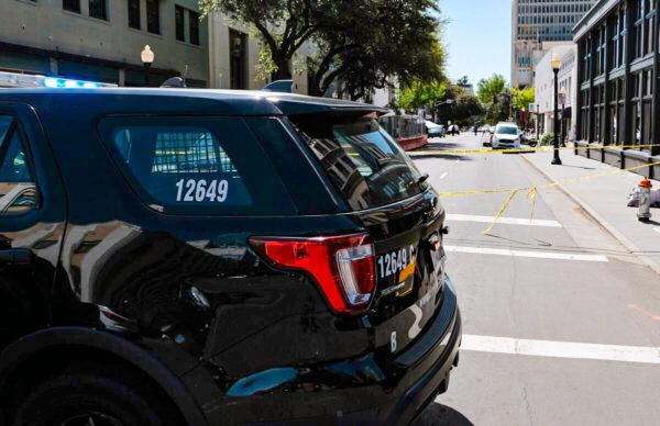 A police car on the corner of 10th and J streets in Sacramento on April 3, 2022. (David Odisho/Getty Images)