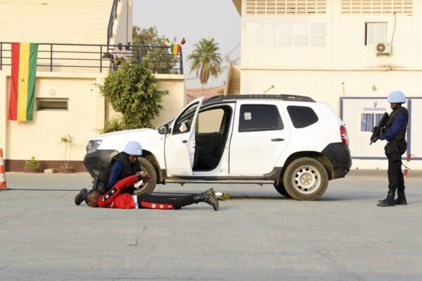 Female soldiers perform a peacekeeping demonstration during the visit of Canadian Prime Minister Justin Trudeau, Jacqueline O'Neill, Canada's ambassador for women, peace, and security, Jean Baptiste Tine, senior commander of Senegal's Gendarmerie and director of Military Justice, and Sidiki Kaba, Senegal's minister of justice, at the Samba Diery Diallo barracks in Colobane, Senegal, on Feb. 13, 2020. (Seyllou/AFP via Getty Images)