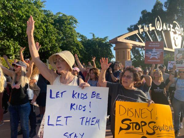 Protestors rally in opposition to The Walt Disney Company's stance against a recently passed Florida law outside of the company's headquarters in Burbank, Calif., on April 6, 2022. (Jill McLaughlin/The Epoch Times)