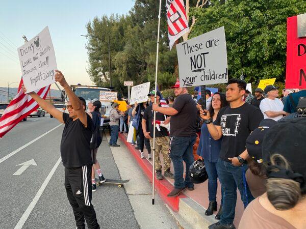 Protestors rally in opposition to The Walt Disney Company's stance against a recently passed Florida law outside of the company's headquarters in Burbank, Calif., on April 6, 2022. (Jill McLaughlin/The Epoch Times)