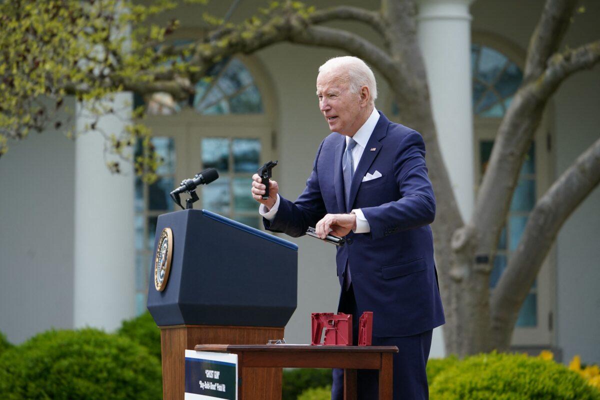 President Joe Biden holds up a "ghost gun" kit during an event at the White House in Washington on April 11, 2022. (Mandel Ngan/AFP via Getty Images)