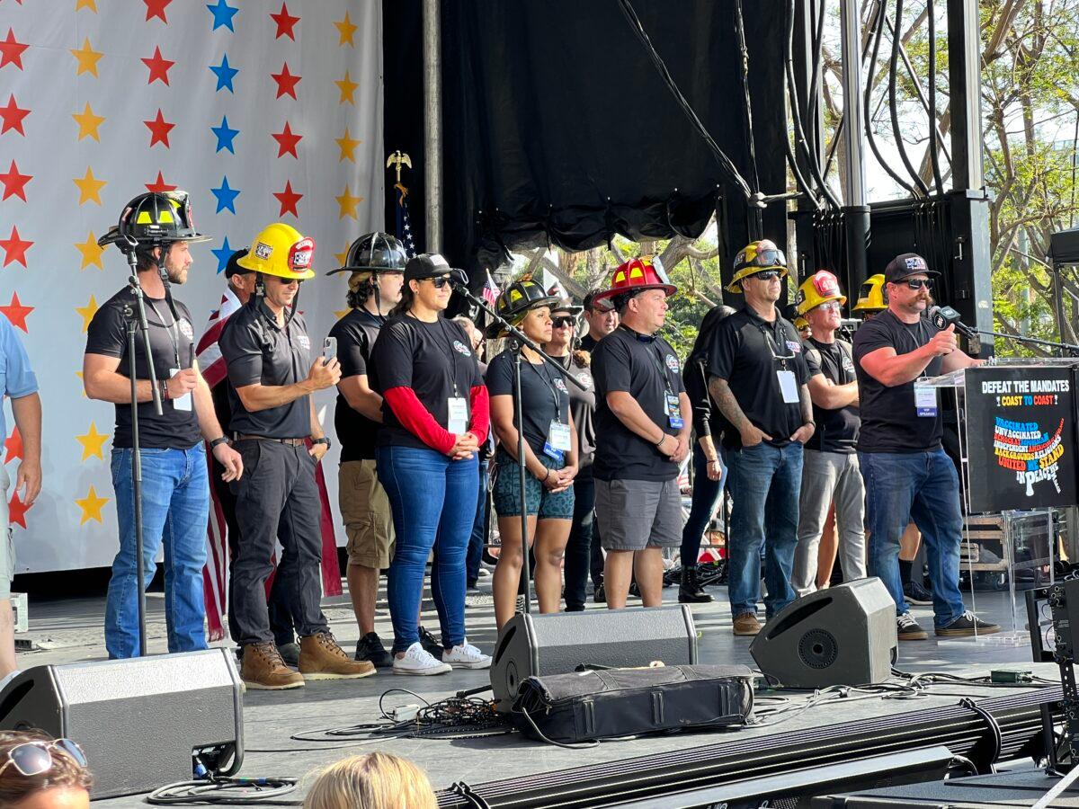 Los Angeles area firefighters speak at the “Defeat the Mandates” rally in Los Angeles on April 10, 2022. (Brad Jones/The Epoch Times)