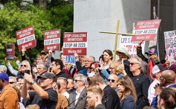 Protesters gather in opposition to AB 2223 on the southside of the California State Capitol building on April 19, 2022. (John Fredricks/The Epoch Times)