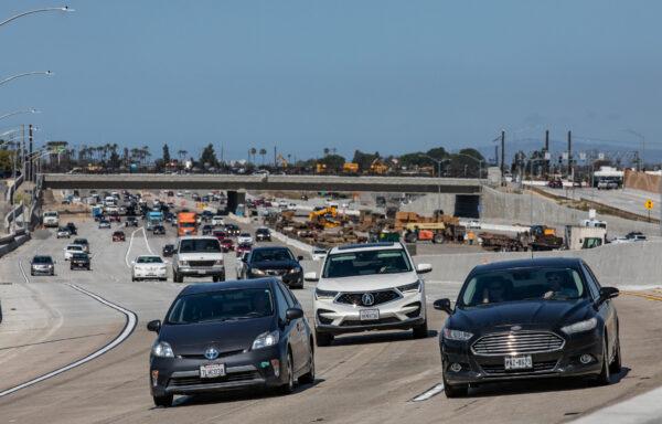 Cars merge onto the State Route 73 southern interchange from Interstate 405 in Costa Mesa, Calif., on April 21, 2022. (John Fredricks/The Epoch Times)