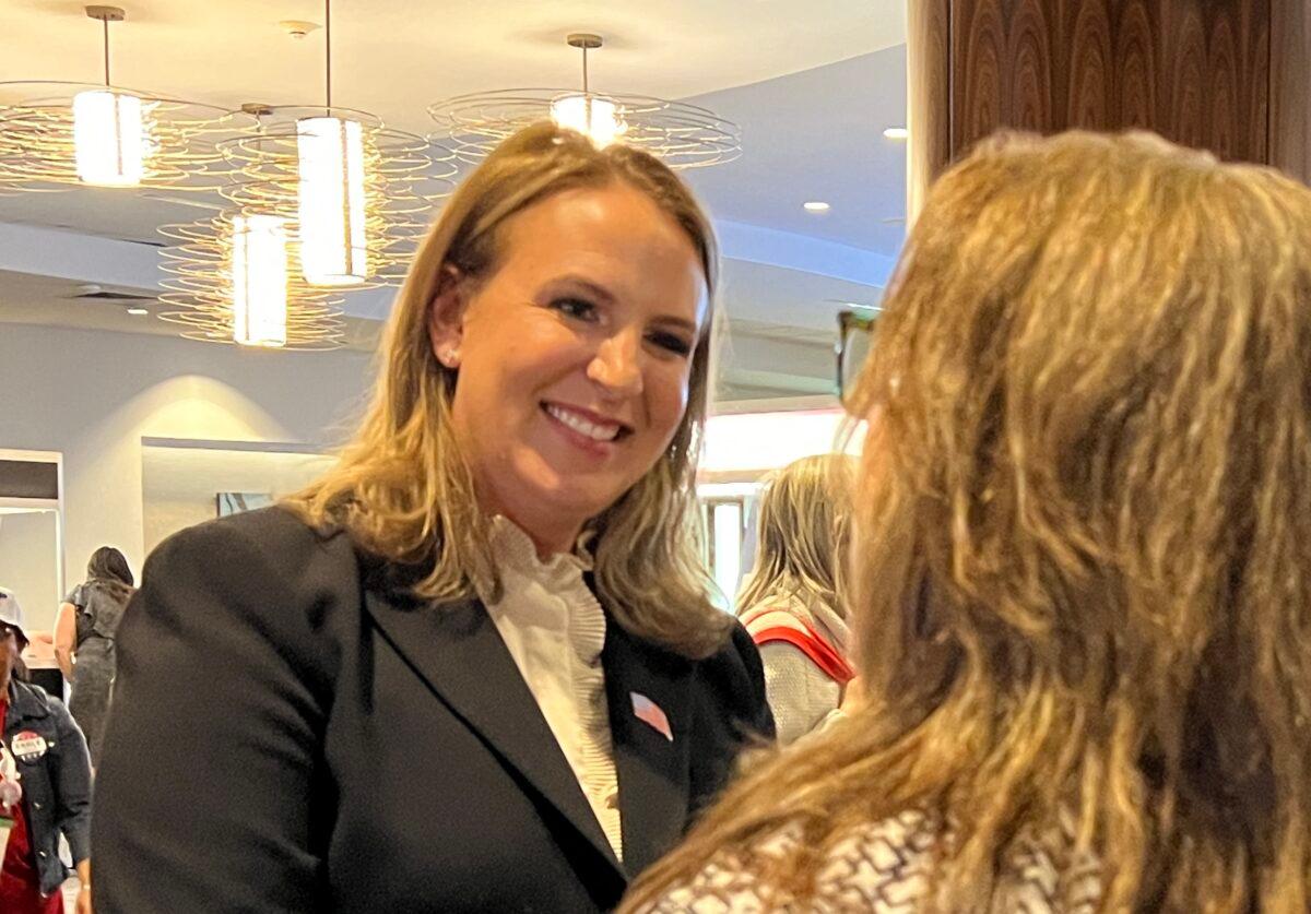 Jenny Rae Le Roux talks to a supporter in the lobby at the California Republican Party convention in Anaheim, Calif., on April 23, 2022. (Brad Jones/The Epoch Times)