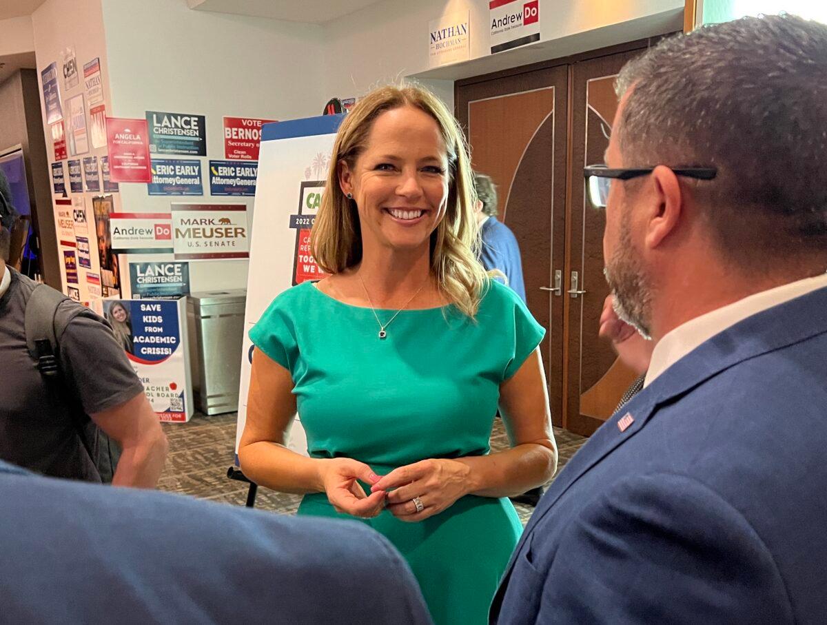 Rachel Hamm mingles with supporters in the lobby at the California Republican Party convention in Anaheim, Calif., on April 23, 2022. (Brad Jones/The Epoch Times)