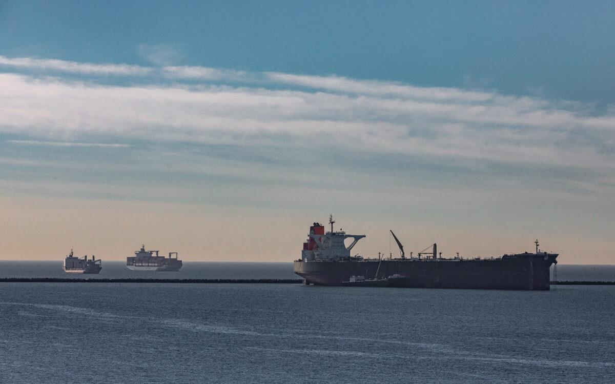 Ships wait access to the Ports of Long Beach and Los Angeles off of Long Beach, Calif., on Jan. 11, 2022. (John Fredricks/The Epoch Times)