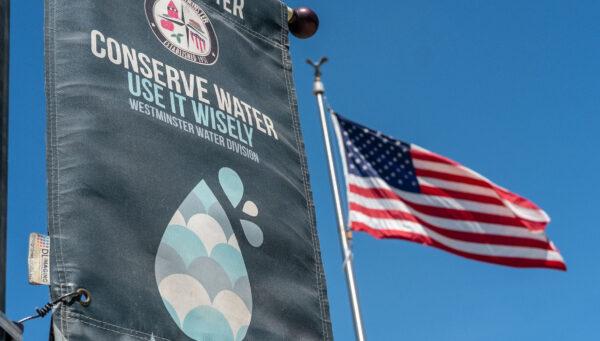 A sign to conserve water sits displayed in Westminster, Calif., on May 10, 2022. (John Fredricks/The Epoch Times)