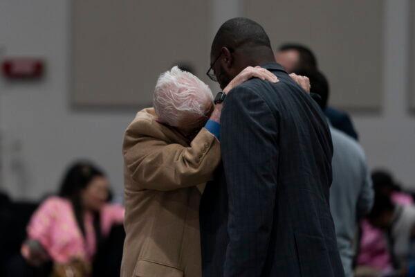 Two men chat at a prayer vigil in Irvine, Calif., on May 16, 2022. The vigil was held to honor victims in Sunday's shooting at Geneva Presbyterian Church in Laguna Woods, Calif. (Jae C. Hong/AP Photo)