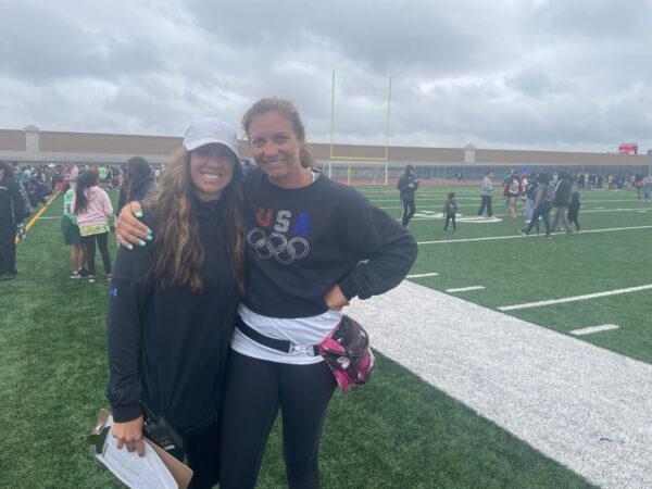 Olympic champion Misty May-Treanor (R), and Marcia Bradbeer, event coordinator for the Garden Grove Unified School District’s 51st “Special Games” Olympic-style competitions, at Bolsa Grande High School in Garden Grove, Calif., on May 20, 2022. (Carol Cassis/The Epoch Times)