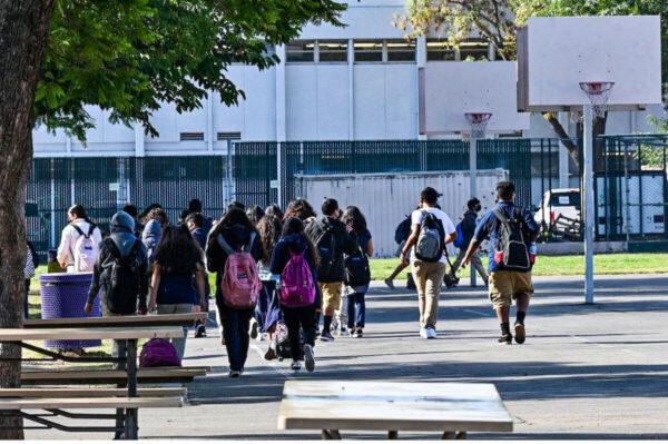 Students walk to their classrooms at a public middle school in Los Angeles on Sept. 10, 2021. (Robyn Beck/AFP via Getty Images)