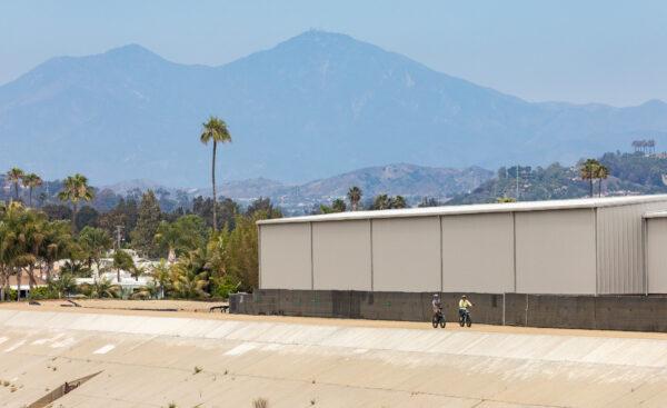 A couple rides E-Bikes in San Juan Capistrano, Calif., on June 7, 2022. (John Fredricks/The Epoch Times)
