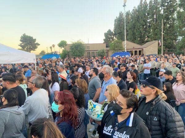 In honor of two El Monte police officers killed in a recent motel shooting, hundreds of community members, law enforcement officers, and family members gathered at a candlelight vigil outside the El Monte Civic Center in El Monte, Calif., on June 18, 2022. (Linda Jiang/The Epoch Times)