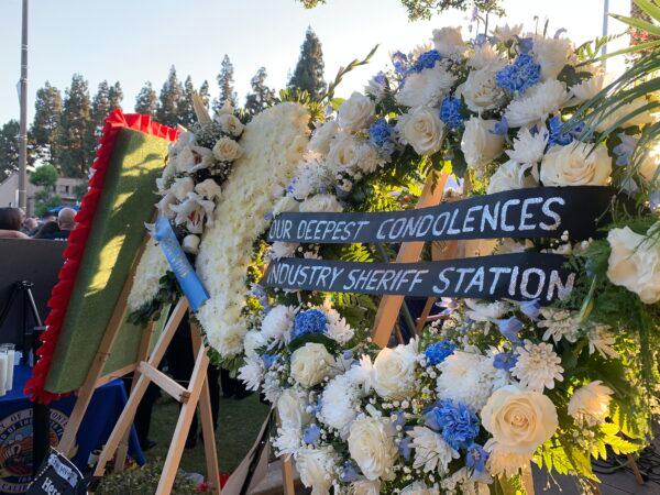 In honor of two El Monte police officers killed in a recent motel shooting, hundreds of community members, law enforcement officers, and family members gathered at a candlelight vigil outside the El Monte Civic Center in El Monte, Calif., on June 18, 2022. (Linda Jiang/The Epoch Times)