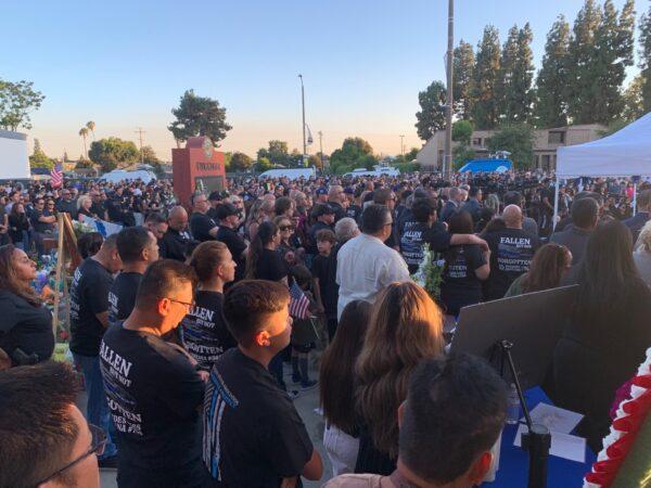 In honor of two El Monte police officers killed in a recent motel shooting, hundreds of community members, law enforcement officers, and family members gathered at a candlelight vigil outside the El Monte Civic Center in El Monte, Calif., on June 18, 2022. (Linda Jiang/The Epoch Times)