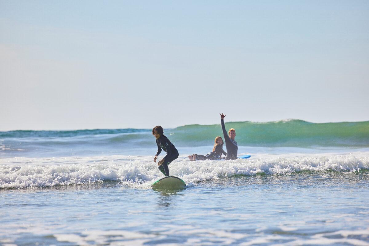 A family learns to surf at The Seabird Resort in Oceanside, California. (Photo courtesy of The Seabird Resort)