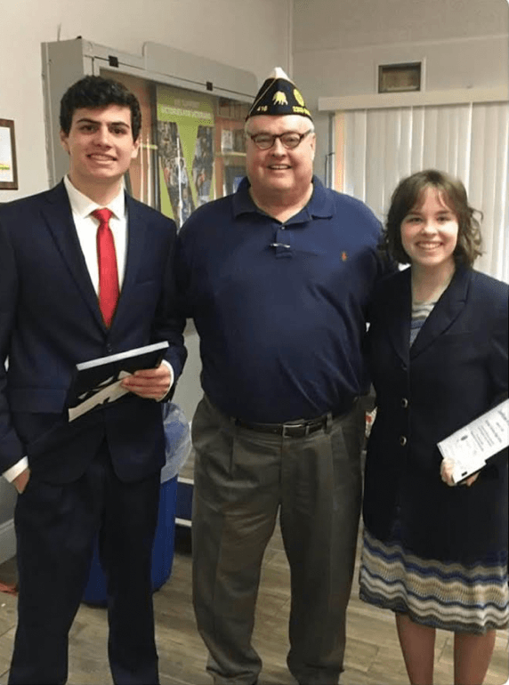 Lewandowski with 2 11th graders who came to speak at his local American Legion Post (2021). (Courtesy of Steve Lewandowski)