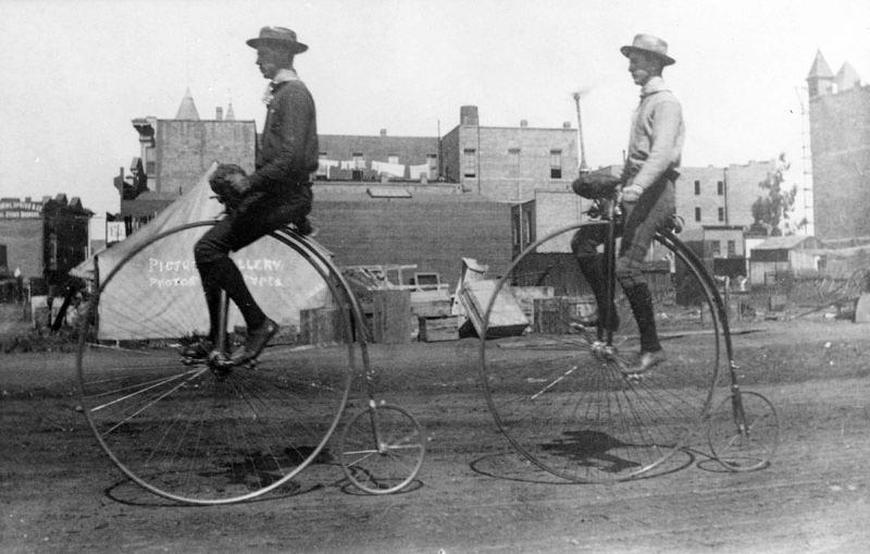 James Irvine (II) and Harry Baechtel on a bike ride from San Fernando to Irvine Ranch, in Santa Ana, Calif., in 1886. (Public Domain)