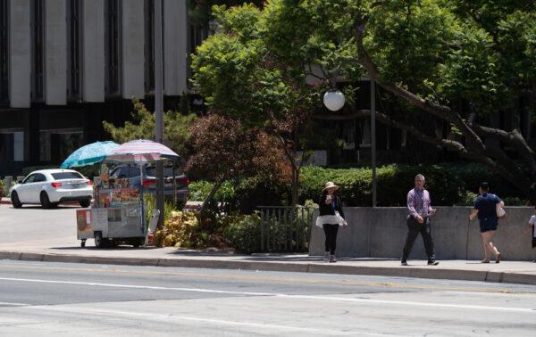 Street vendors sell food items in Santa Ana, Calif., on July 18, 2022. (John Fredricks/The Epoch Times)