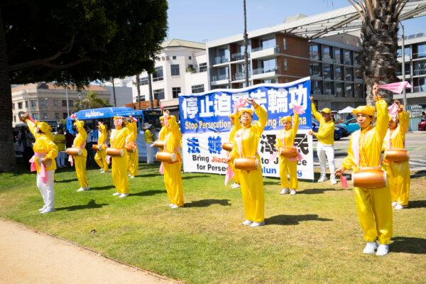 The Los Angeles waist drum team performing at a rally to raise awareness of the CCP persecution of Falun Gong in Santa Monica, Calif. on July 17, 2022. (Debora Cheng/The Epoch Times)