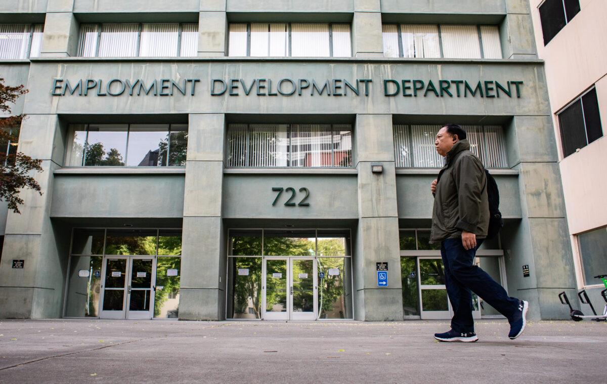 People walk past the California Employment Development Department (EDD) in Sacramento, Calif., on April 18, 2022. (John Fredricks/The Epoch Times)