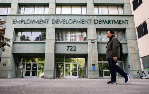 People walk past the California Employment Development Department in Sacramento on April 18, 2022. (John Fredricks/The Epoch Times)