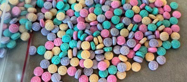 Brightly colored counterfeit M30 oxycodone pills. (Drug Enforcement Administration)