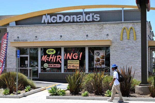 A man walks past a "Hiring" sign at a McDonald's restaurant in Garden Grove, Calif., on July 8, 2022. (Robyn Beck/AFP via Getty Images)