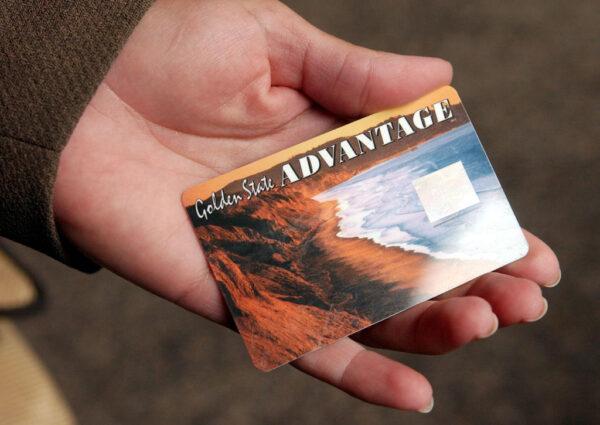 A person holds a California State Electronic Benefit Transfer (EBT) card in Oakland, Calif. on July 17, 2002. (Justin Sullivan/Getty Images)