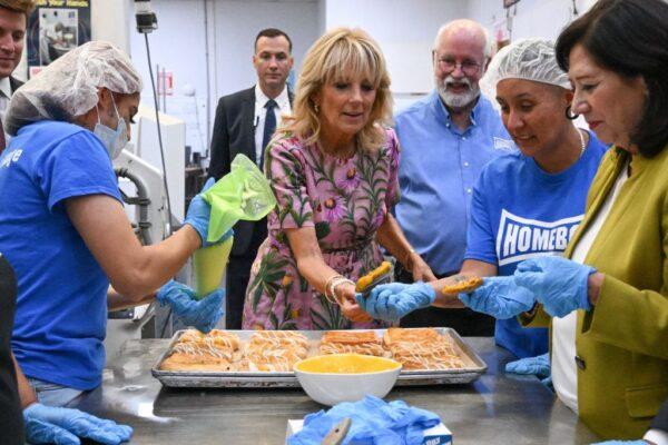 US First Lady Jill Biden next to Homeboy Industries founder Father Gregory Boyle, helps make pastries during a visit to the Homeboy Bakery and Homegirl Cafe in Los Angeles on Sept. 16, 2022. (Robyn Beck/AFP via Getty Images)