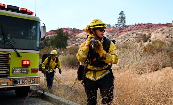 Firefighters work under excessive heat conditions putting out the Fairview Fire in Hemet, Calif., on Sept. 6, 2022. (Frederic J. Brown/AFP via Getty Images)
