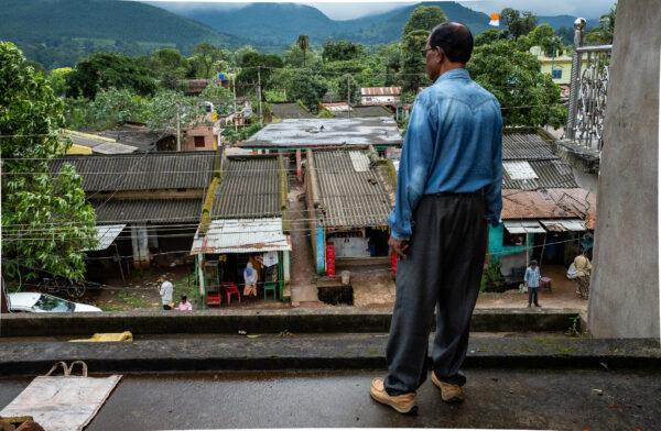 Indian Christian Prikash looks at his neighbors from his home in the Odisha state of India on Sept. 19, 2018. (John Fredricks/The Epoch Times)