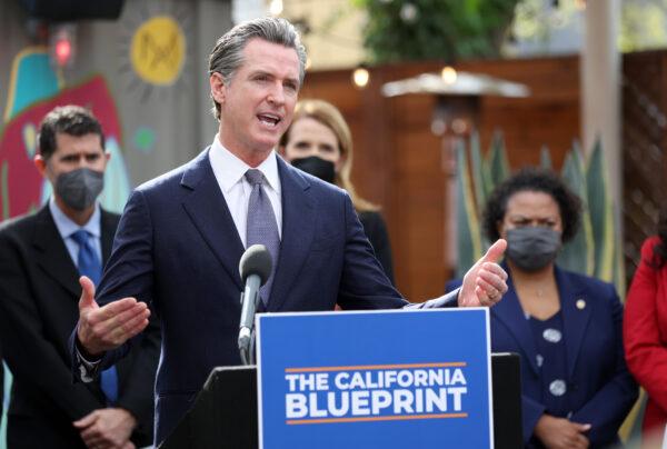 California Gov. Gavin Newsom speaks during a bill signing ceremony at Nido’s Backyard Mexican Restaurant in San Francisco on Feb. 9, 2022. (Justin Sullivan/Getty Images)