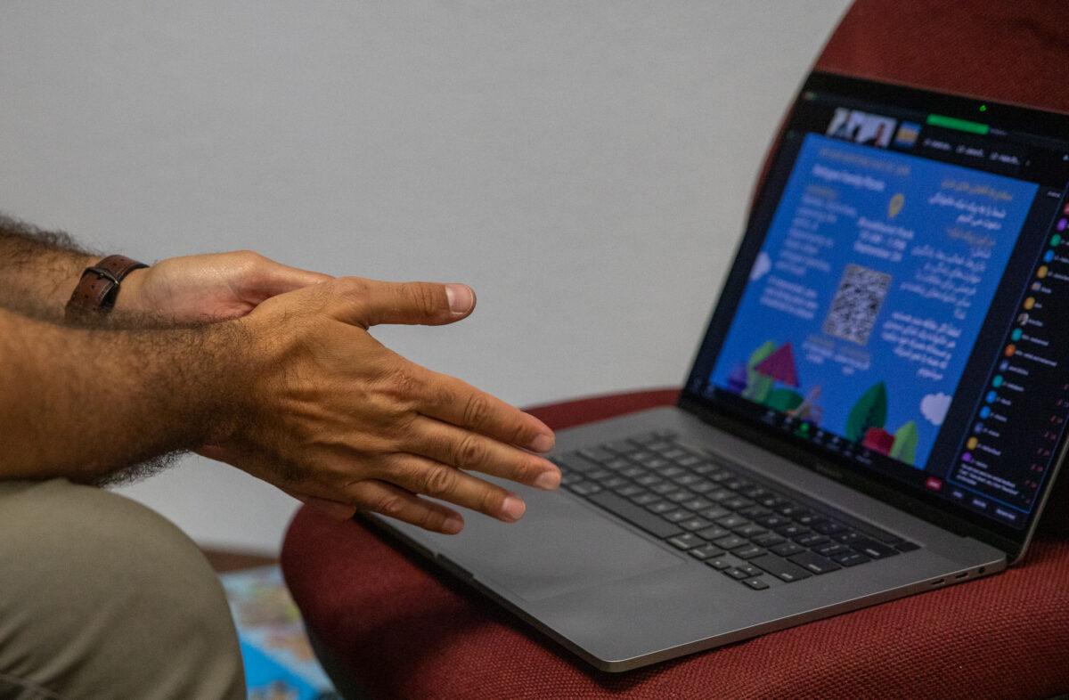 Chris Khoury prepares to teach an online English class at the Voice of Refugees offices in Anaheim, Calif., on Sept. 21, 2022. (John Fredricks/The Epoch Times)