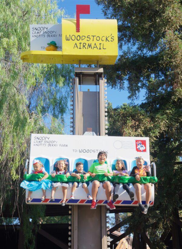 Kids laugh as they ride along with Woodstock’s Airmail. (Courtesy of Karen Gough)