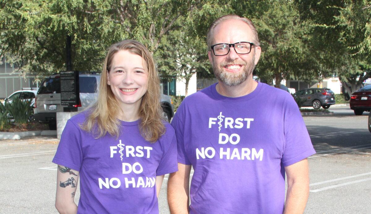 Filmmaker Don Johnson (R) and detransitioner Daisy Strongin, who appears in Johnson's film "Dysconnected," at a protest against transgender medical interventions for children, in Anaheim, Calif., on Oct. 8, 2022. (Brad Jones/The Epoch Times)