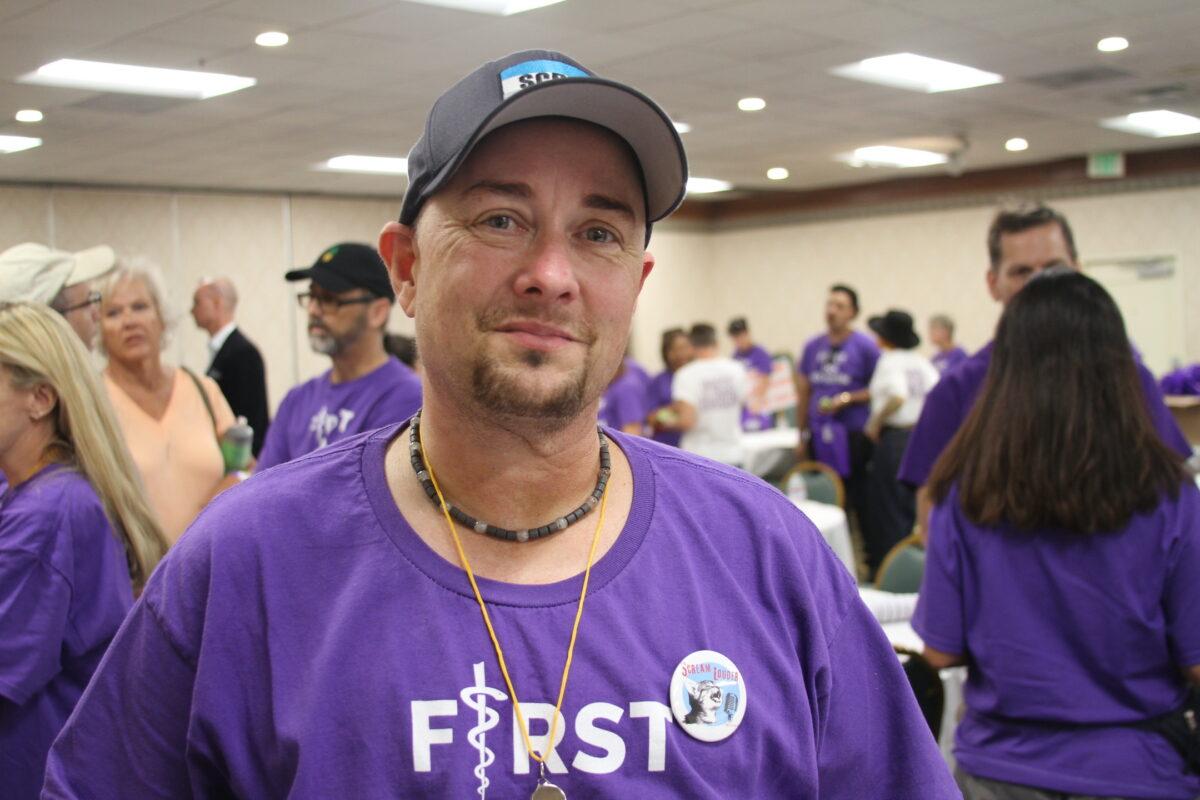 Scott Newgent attends a protest in Anaheim, Calif., on Oct. 8, 2022. (Brad Jones/The Epoch Times)