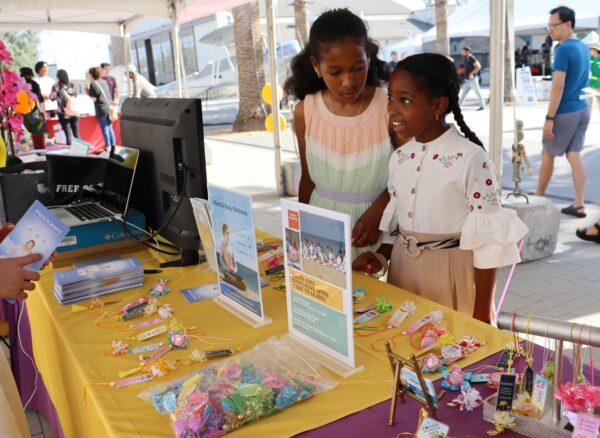 The Falun Gong booth at the 21st Irvine Global Village Festival on Oct. 8, 2022. (Mei Li/ The Epoch Times)