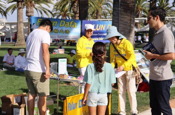 The Falun Gong booth at the 21st Irvine Global Village Festival on Oct. 8, 2022. (Mei Li/ The Epoch Times)