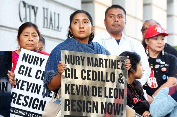 Protestors demonstrate outside City Hall calling for the resignations of L.A. City Council members Kevin de León and Gil Cedillo in the wake of a leaked audio recording in Los Angeles on Oct. 12, 2022. (Mario Tama/Getty Images)