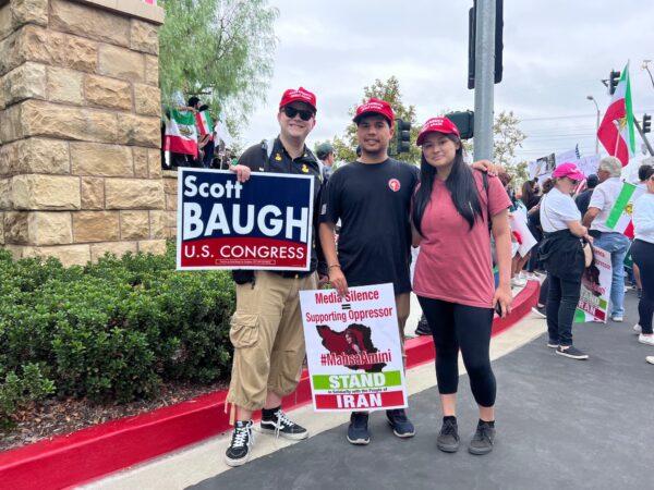 College student Caitlyn (R) joins protesters at Irvine Valley College during President Joe Biden's speech there in Irvine, Calif., on Oct. 14, 2022. (Rudy Blalock/The Epoch Times)