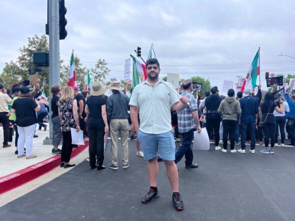 Irvine resident Behrang Borhani joins protesters at Irvine Valley College during President Joe Biden's speech there in Irvine, Calif., on Oct. 14, 2022. (Rudy Blalock/The Epoch Times)