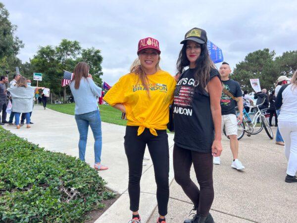Huntington Beach resident Nancy Kerr (L) joins protesters at Irvine Valley College during President Joe Biden's speech there in Irvine, Calif., on Oct. 14, 2022. (Rudy Blalock/The Epoch Times)