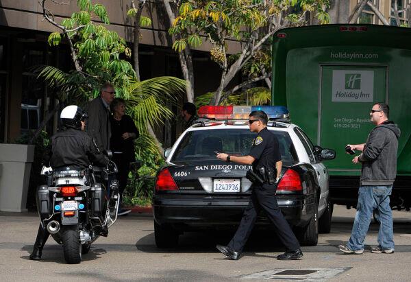Police search for a suspect in San Diego, Calif., on Feb. 7, 2013. (Denis Poroy/Getty Images)