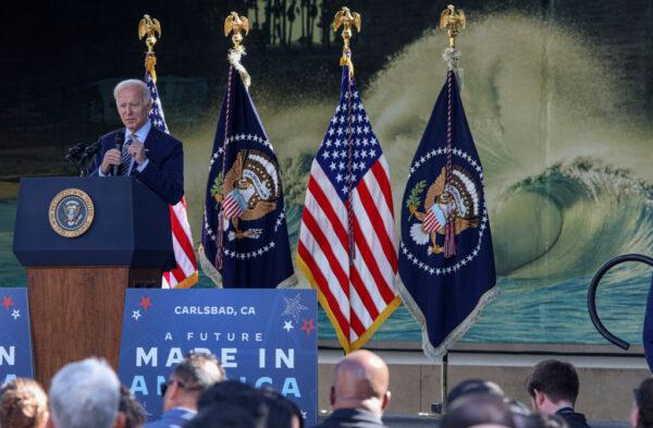 U.S. President Joe Biden speaks with dignitaries and employees at ViaSat in Carlsbad, Calif., on Nov. 4, 2022. (Sandy Huffaker/Getty Images)