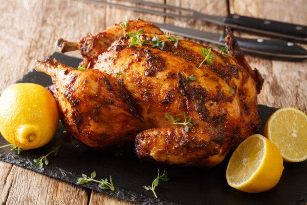 Roasted chicken is an easy-to-prepare, inexpensive meal with leftovers that can stretch to several more dishes. (Sergii Koval/Shutterstock)