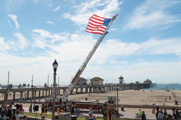 A crowd gathers for the Veterans Day ceremony at Pier Plaza in Huntington Beach, Calif., on Nov. 11, 2022. (Julianne Foster/The Epoch Times)