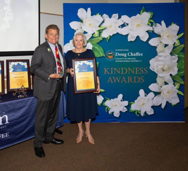 Verne Wagner (R) receives an award at the Fourth District Kindness Awards ceremony in Fullerton, Calif., on Nov. 13, 2022. (Courtesy of the Office of Chairman Doug Chaffee)